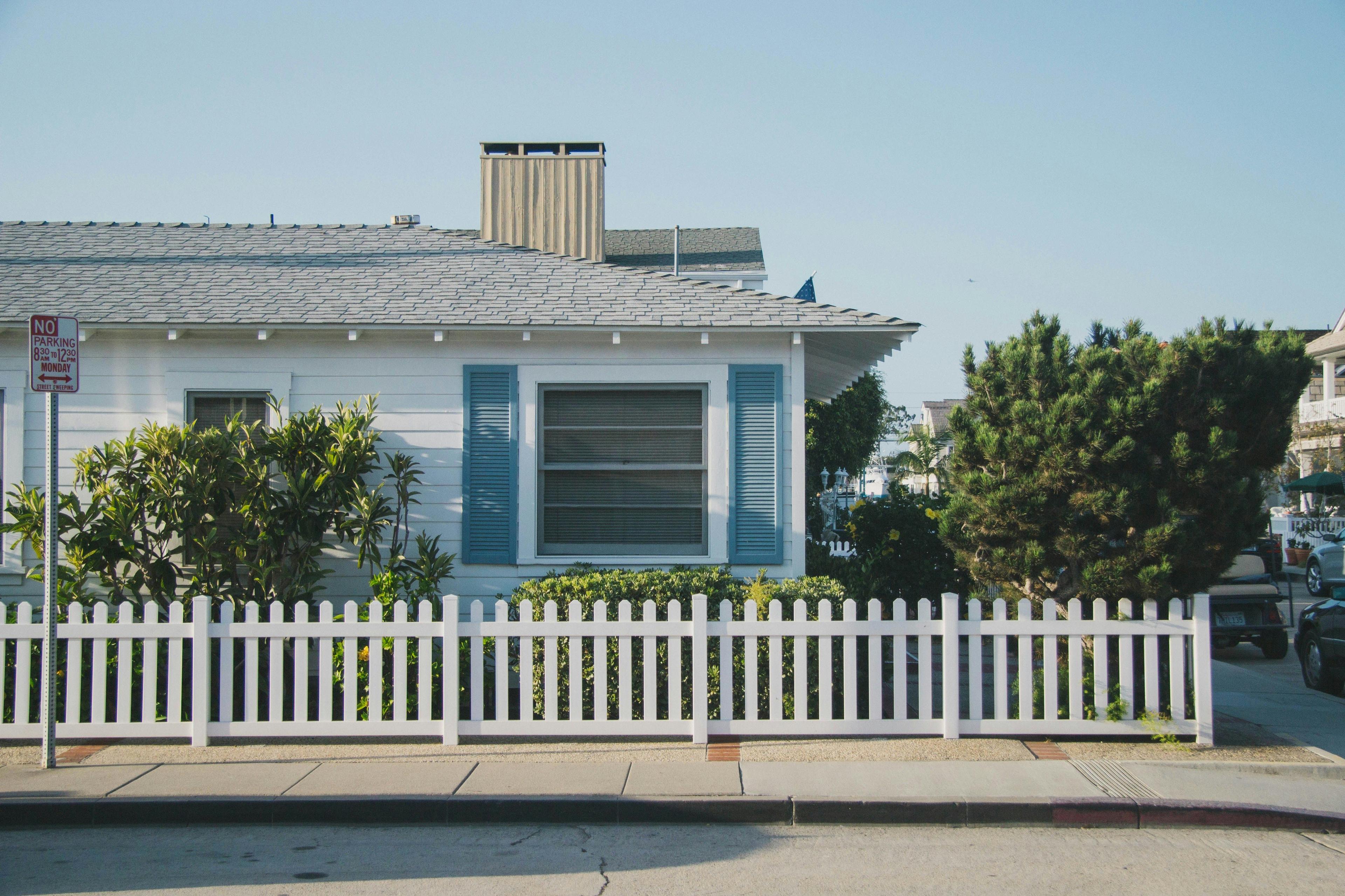 Corner home with white fence